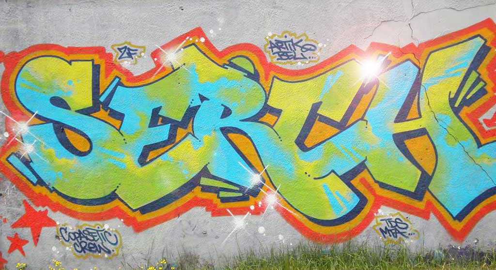 Graffiti tag: SERCH. Green & blue with orange and red strokes